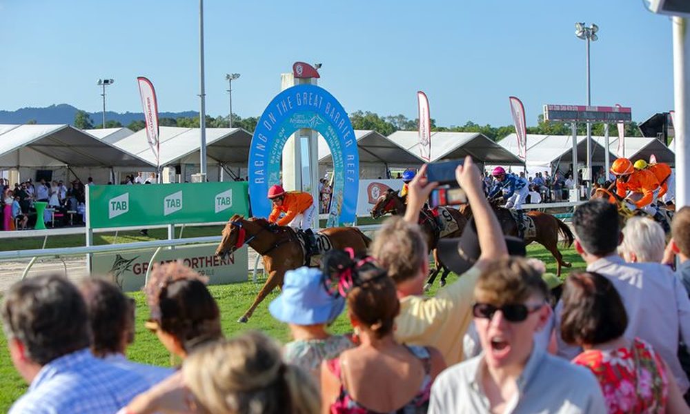 Cairns Amateurs race day action at Cannon Park Racecourse with excited crowd cheering on the Great Barrier Reef