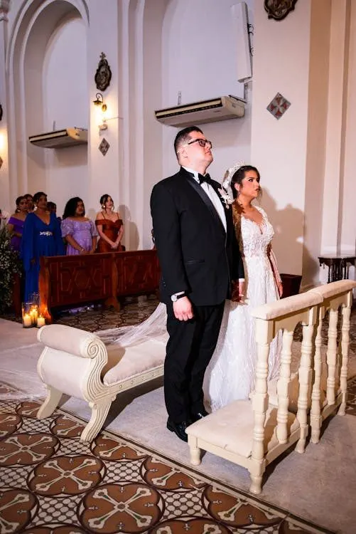 Elegant wedding ceremony in a beautifully ornate church where guests gather in formal attire