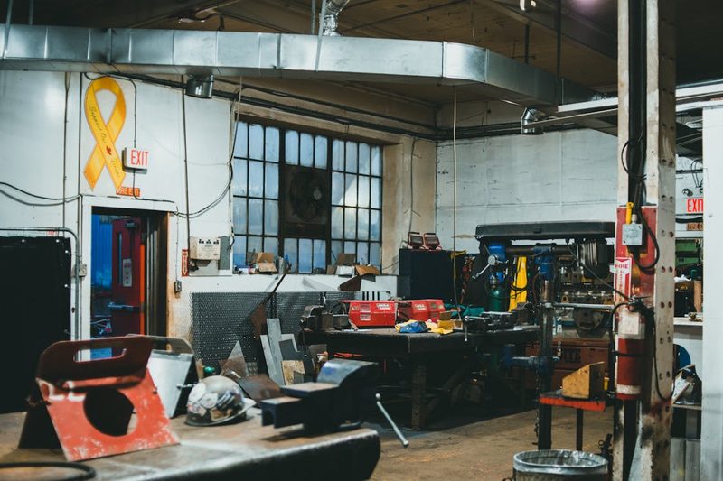Interior of a traditional craft workshop with tools and machinery used for shaping and forming