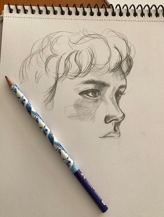 Pencil sketch on paper capturing a designer's creative vision the first step in bringing a bespoke hat to life