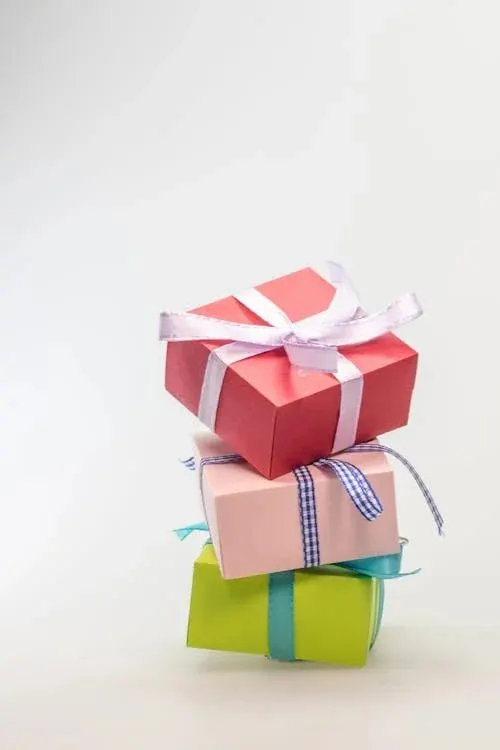 Stacked elegant hat boxes in different colours ideal for proper hat storage and protection