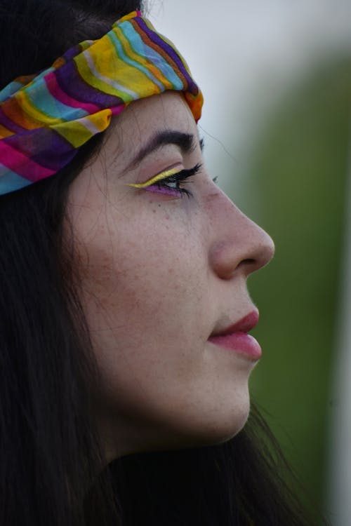 Close-up of a woman wearing an embellished headband showing the band structure and decorative detail