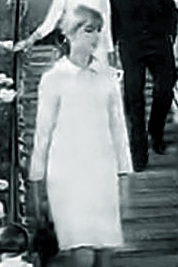 Jean Shrimpton wearing her iconic white mini-dress without a hat at Flemington Racecourse on Derby Day 1965, the fashion moment that shocked Australian racing
