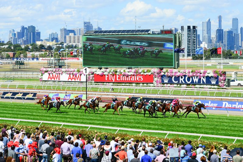 Spring racing crowd in festive attire at Flemington Racecourse on Super Saturday