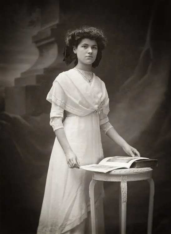 Vintage-styled portrait of a woman in an elegant hat demonstrating how millinery photographs beautifully