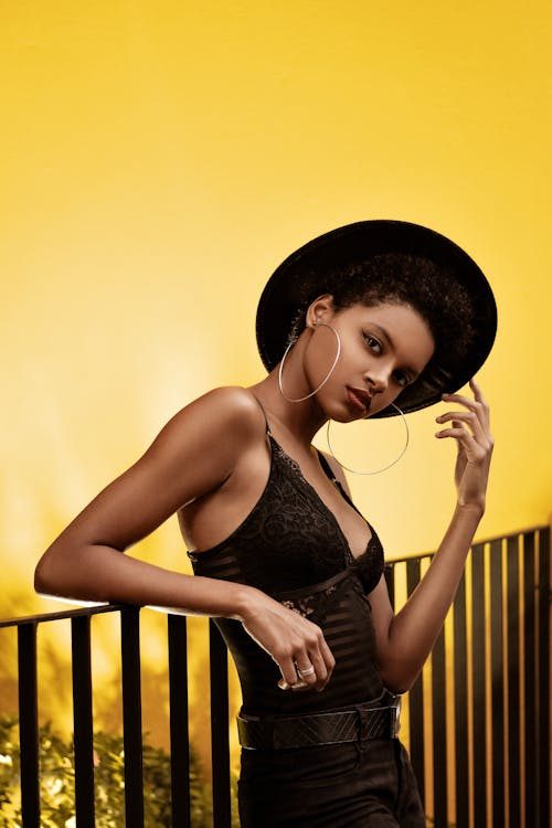 Stylish woman wearing a classic fedora hat in a fashion editorial portrait