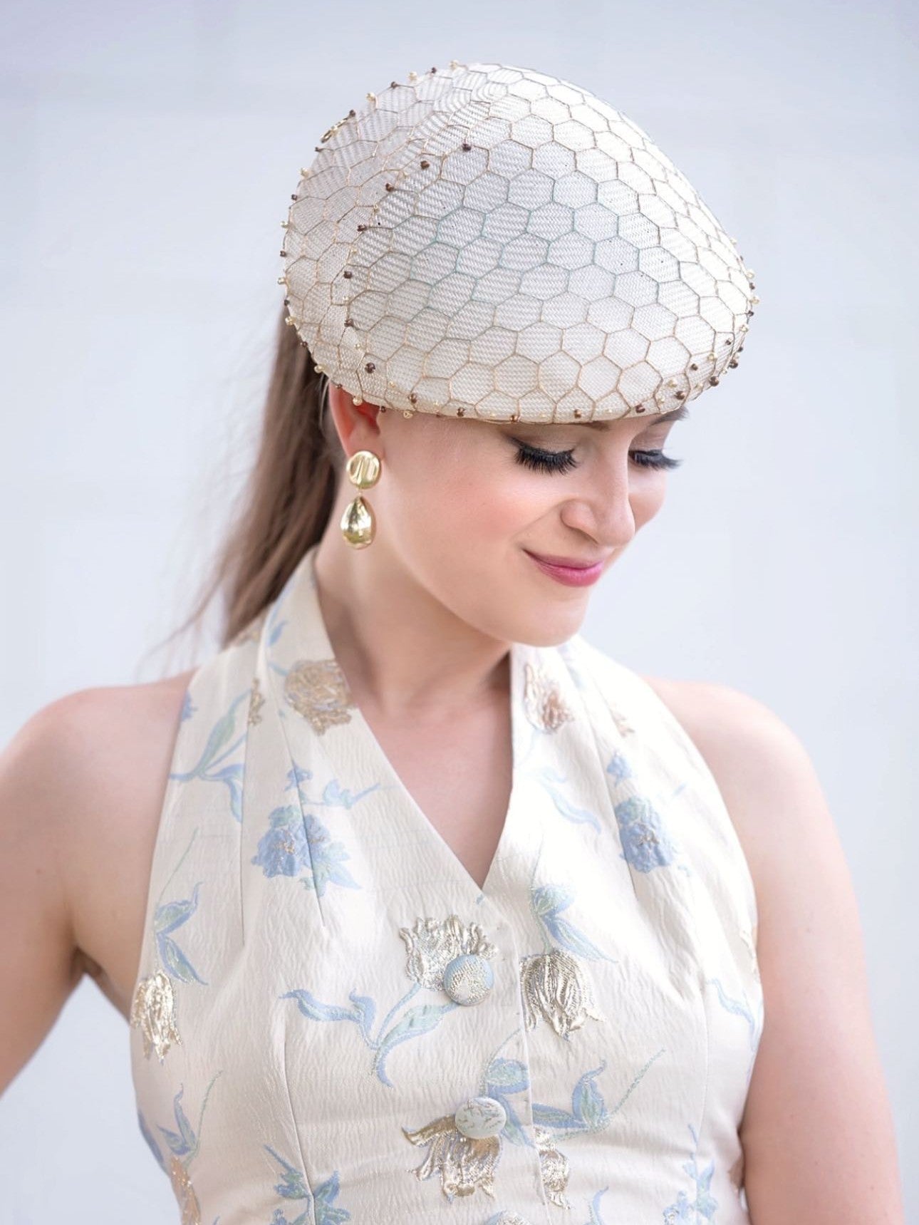 Client at racing event wearing Kathryn Lee Millinery - race day style inspiration photo