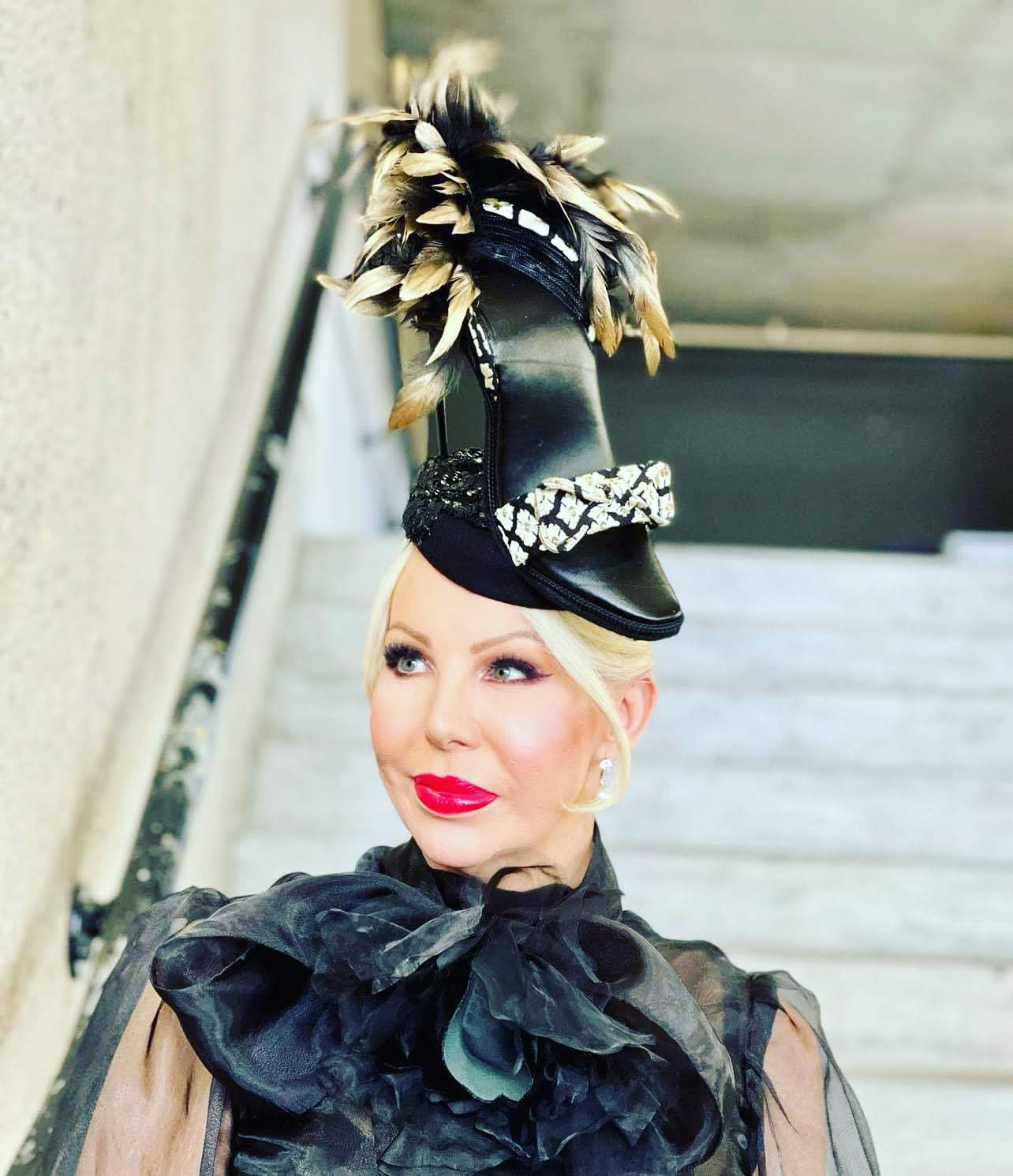 Striking black satin top hat with gold feather plumes - couture millinery by Kathryn Lee for statement occasions