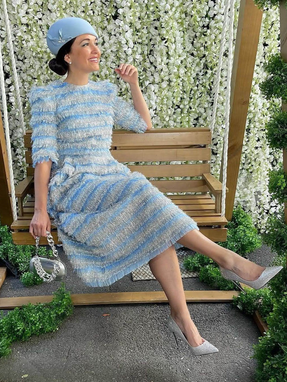 Elegant race day styling featuring a bespoke light blue beret by Kathryn Lee Millinery with striped blue dress