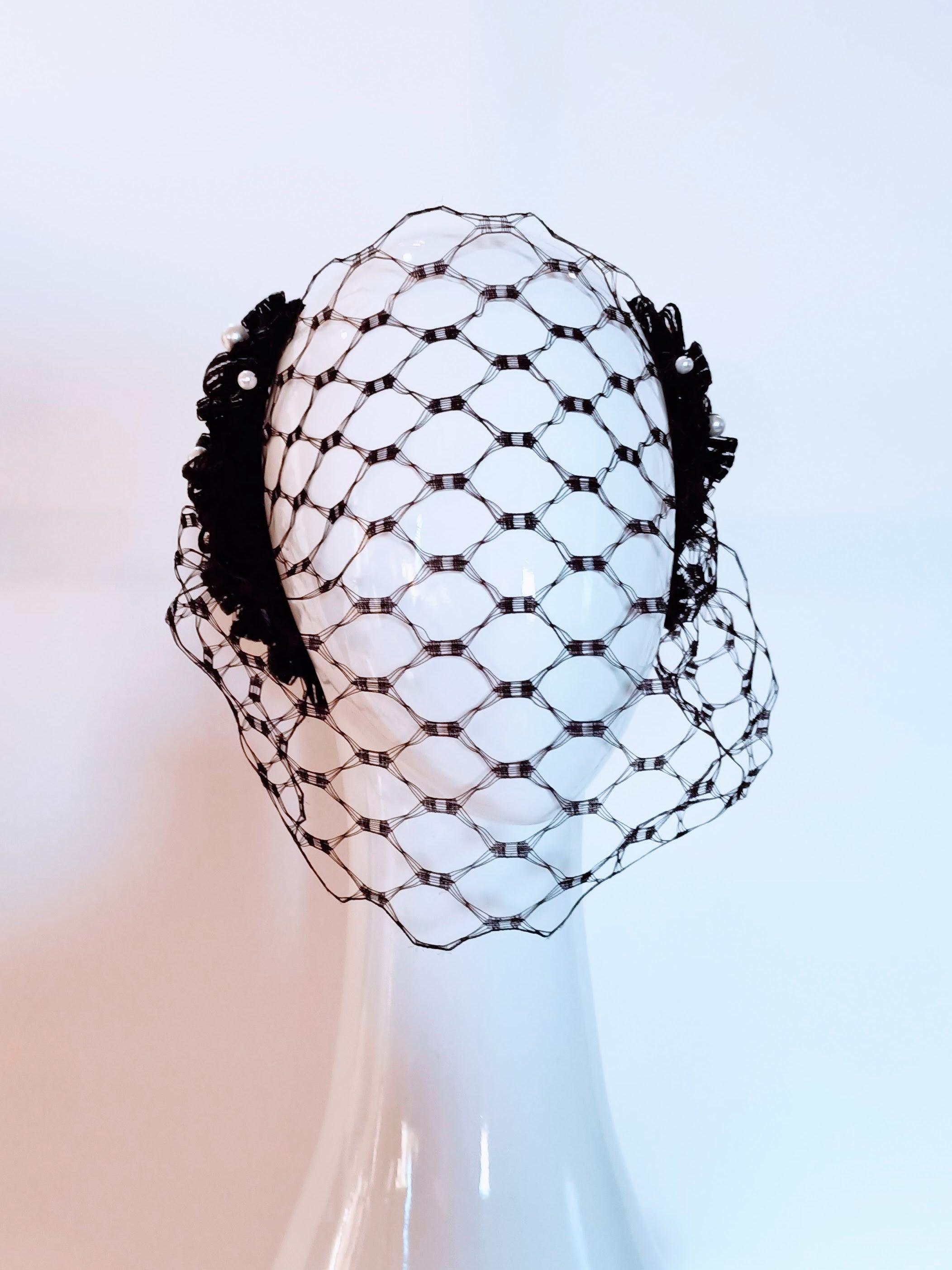Black Charlotte headpiece crafted from pearl – luxury racing headwear by Kathryn Lee