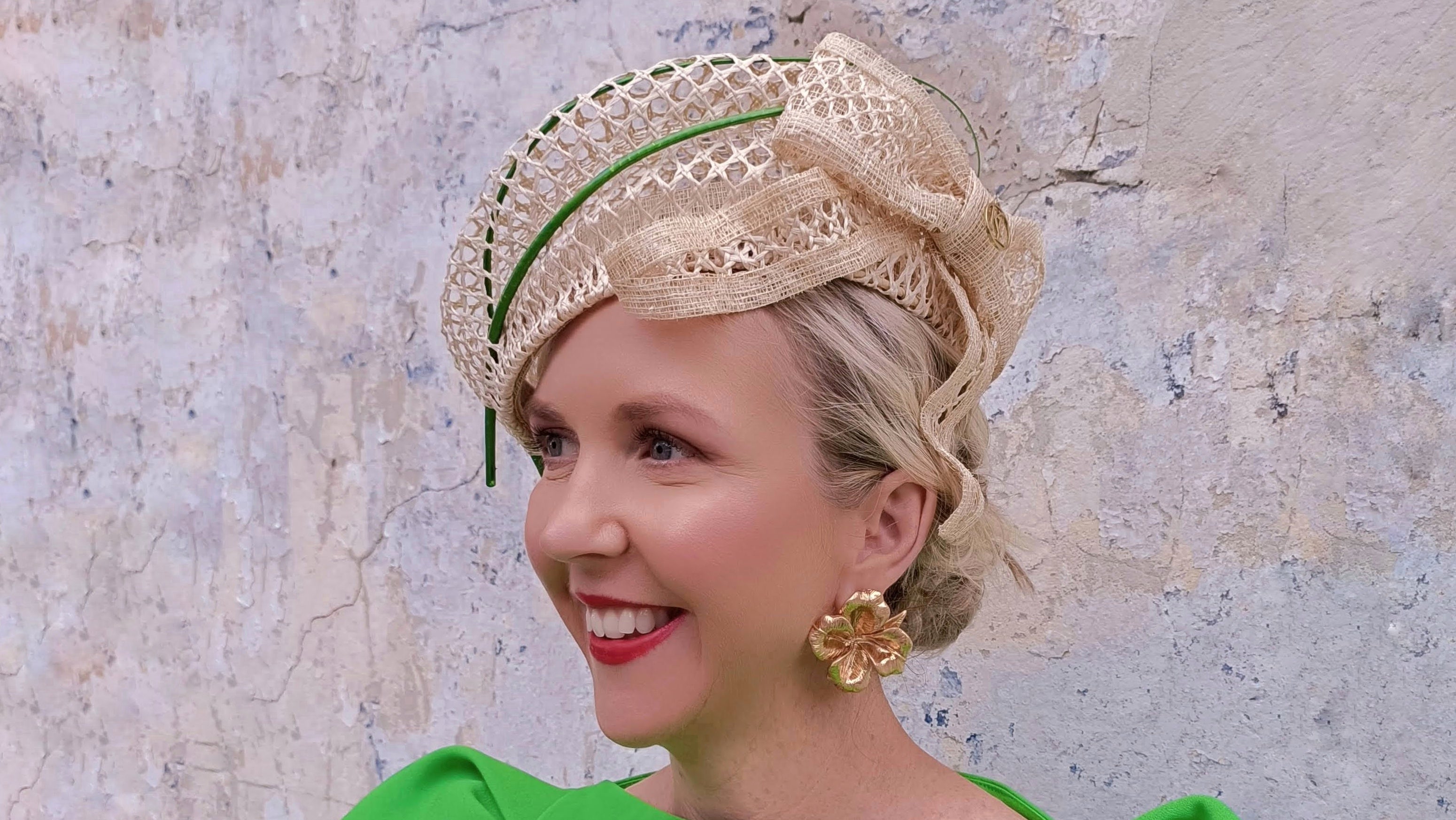 Natural straw woven headpiece by Kathryn Lee Millinery with emerald green dress - race day client photo