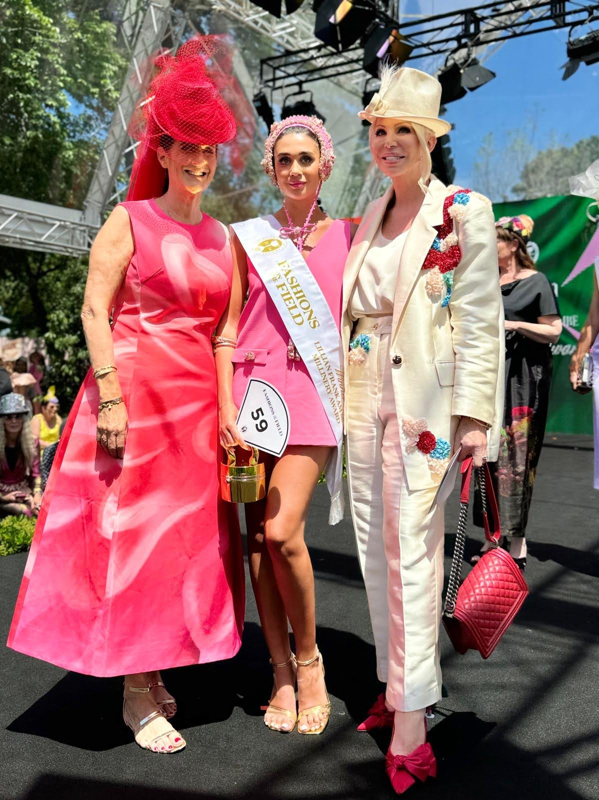 Fashions on the field millinery award winner wearing pink beaded headpiece by Kathryn Lee Millinery