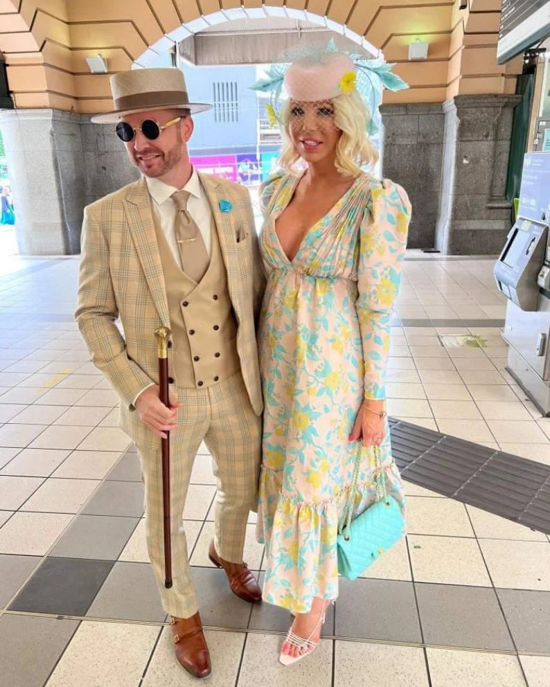 Race day couple wearing Kathryn Lee Millinery - straw boater hat and mint fascinator with floral outfits