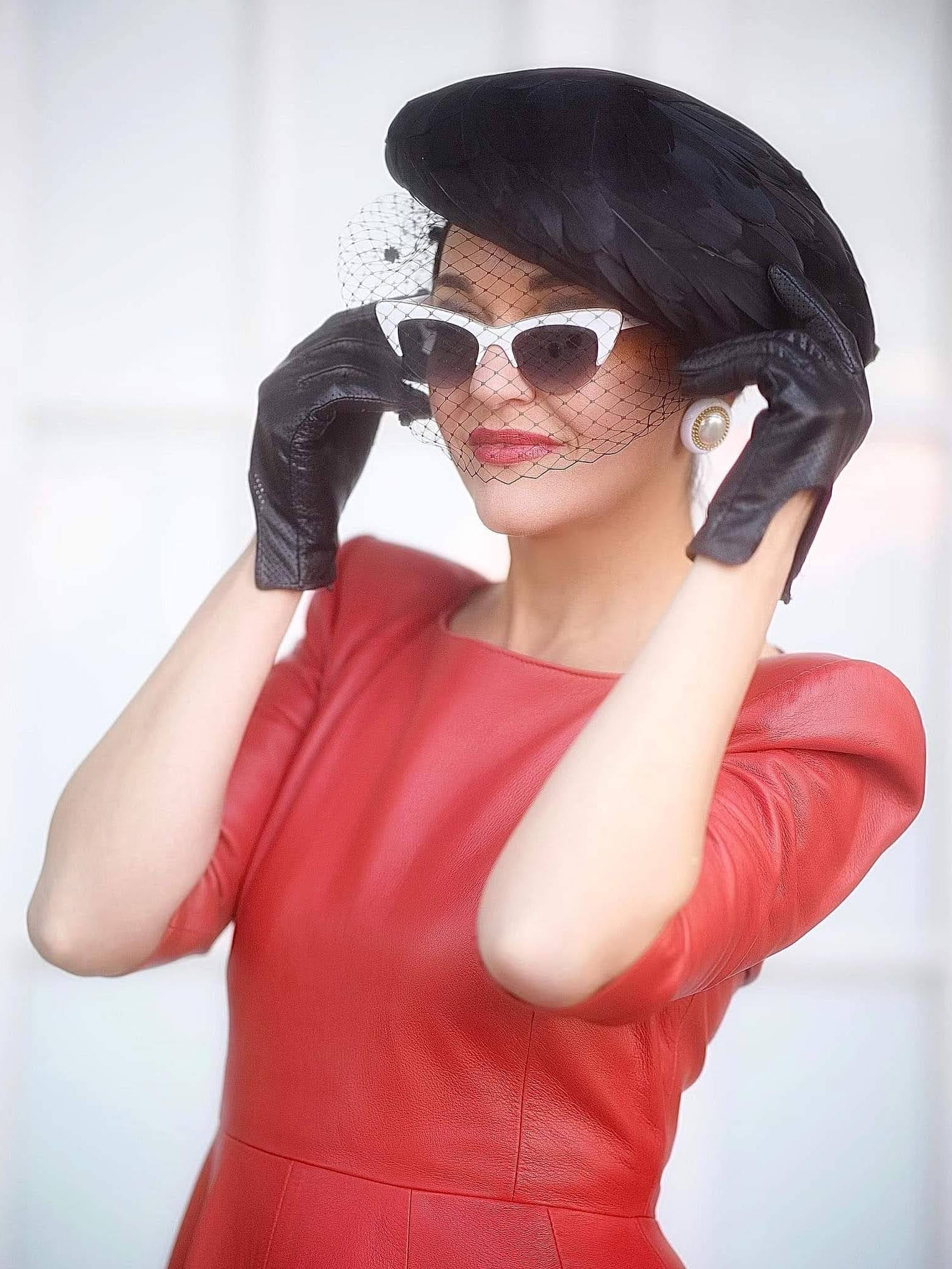 Client wearing Kathryn Lee Millinery hat at a special occasion - happy customer testimonial photo