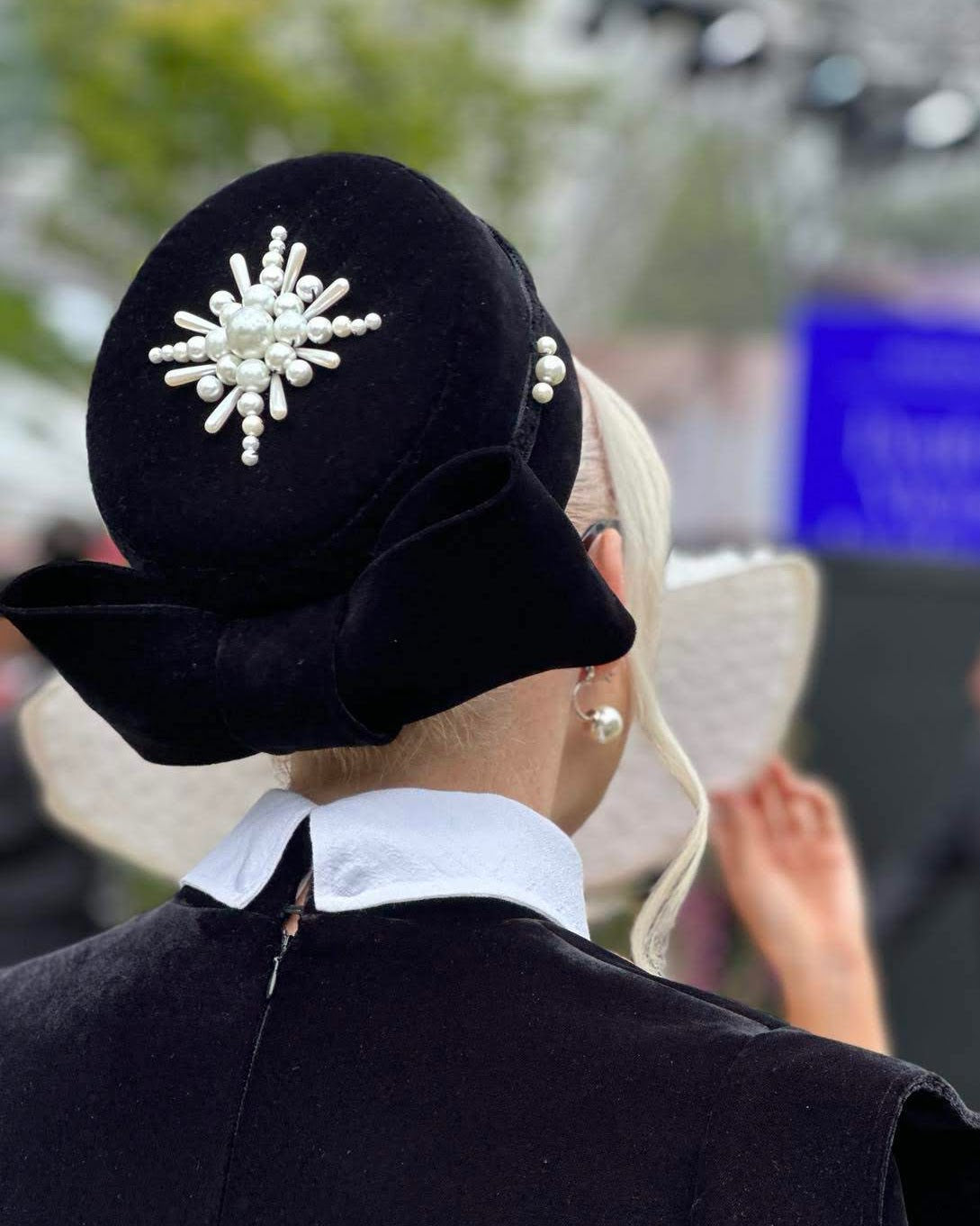 Race day headwear by Kathryn Lee Millinery on client at racing carnival event