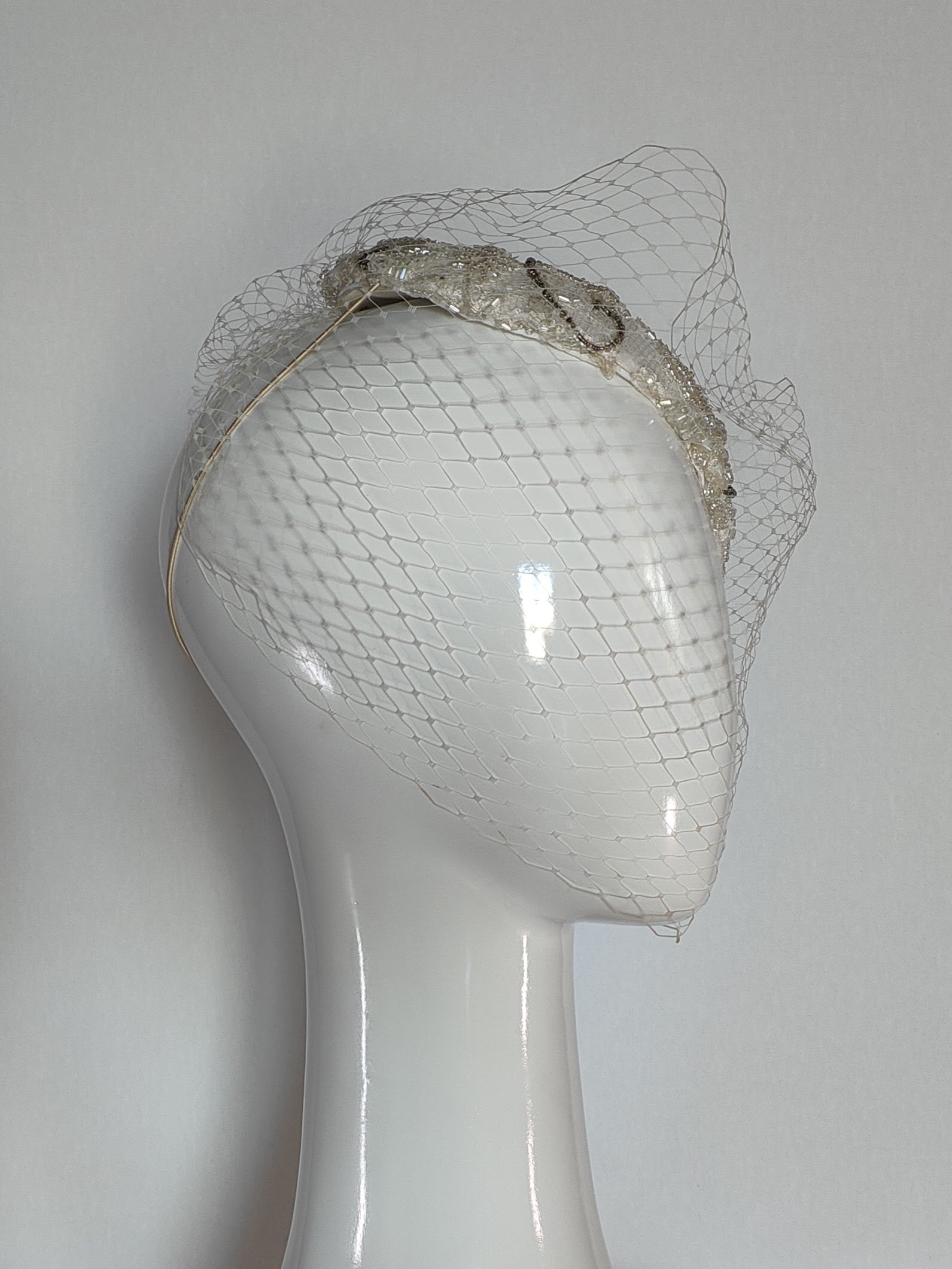 Victoria White headpiece crafted from lace by Kathryn Lee Millinery, Australian bespoke milliner