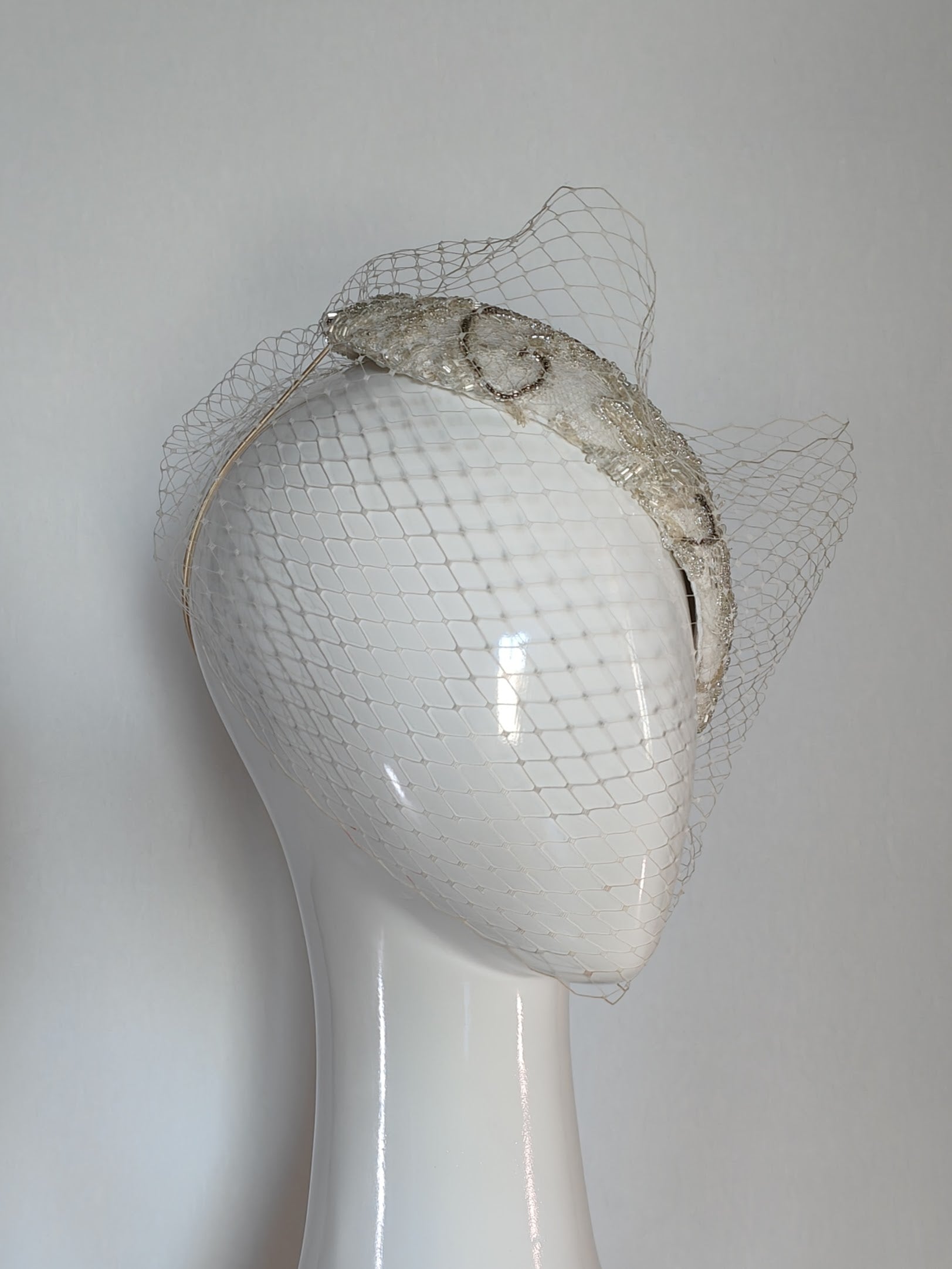 Bespoke White headpiece Victoria – couture millinery for polo