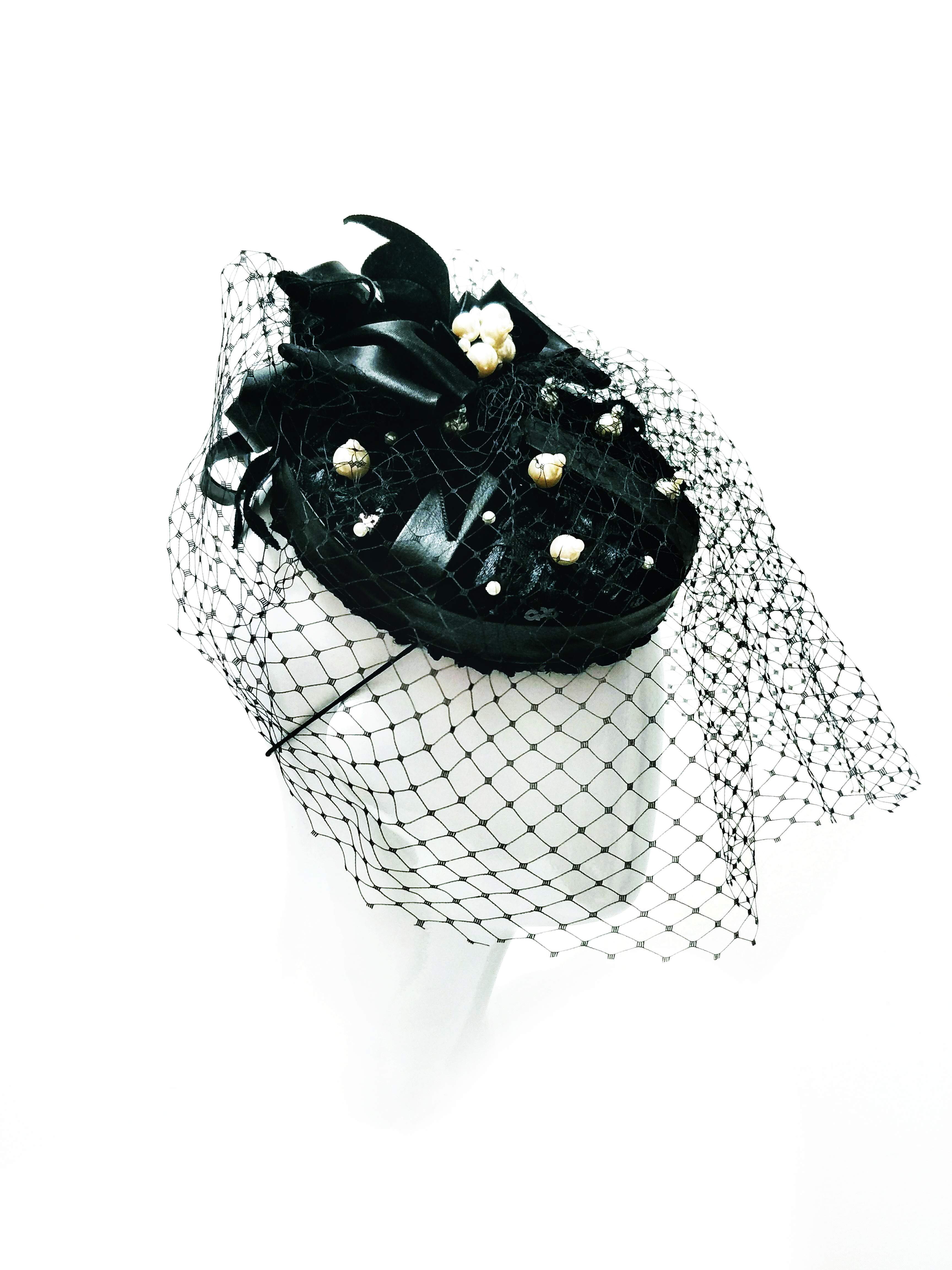 Alexis pillbox hat from the Kathryn Lee Millinery collection featuring leather and lace
