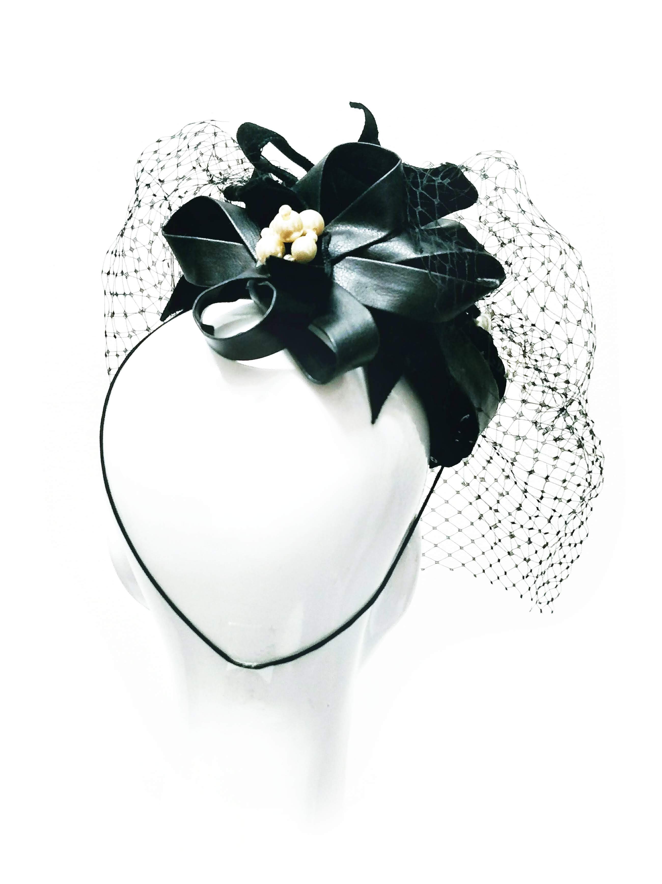 Alexis pillbox hat crafted from leather and lace – luxury racing headwear by Kathryn Lee