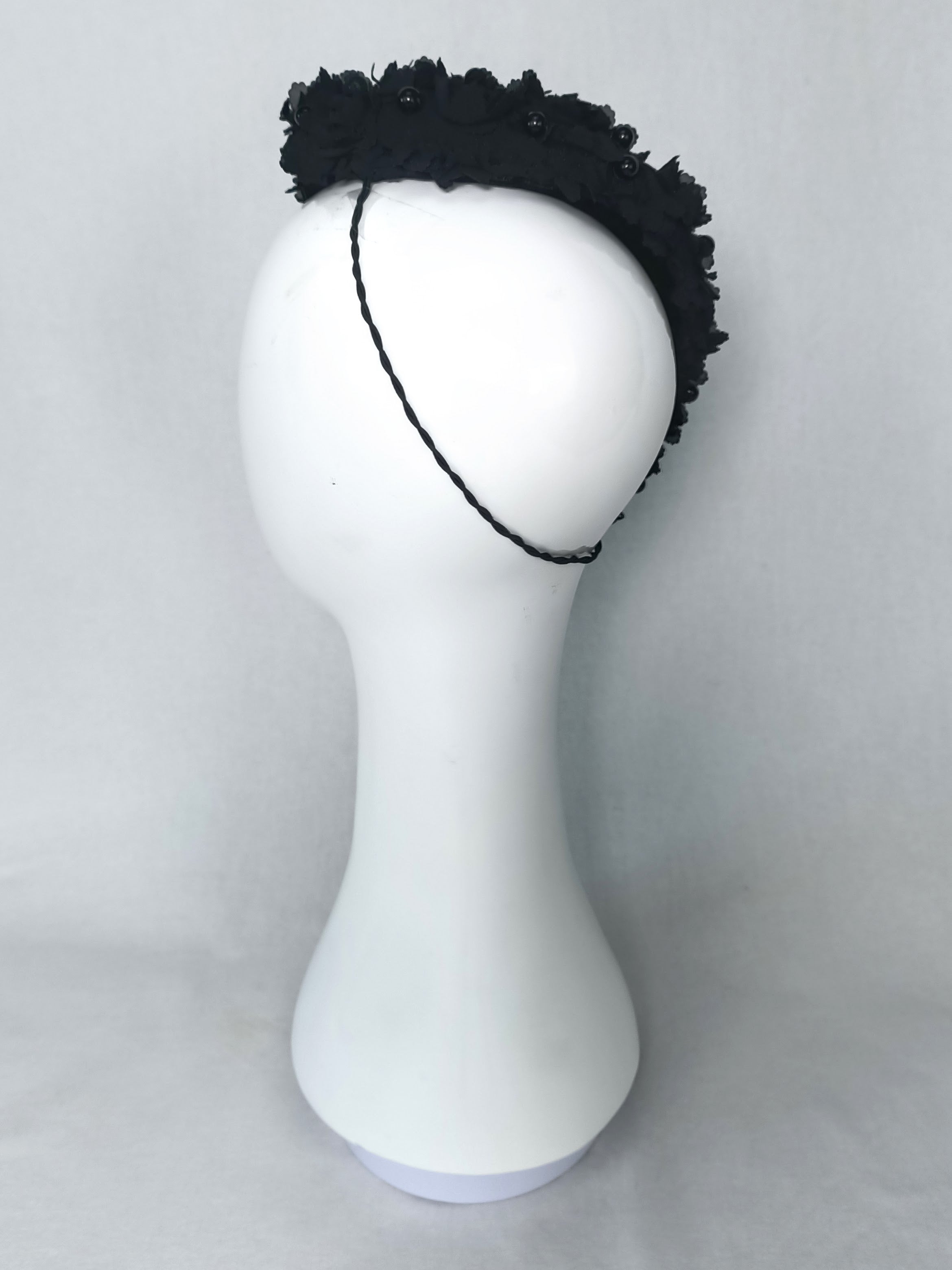 Black Pearl Black fascinator crafted from silk and pearl by Kathryn Lee Millinery, Australian bespoke milliner