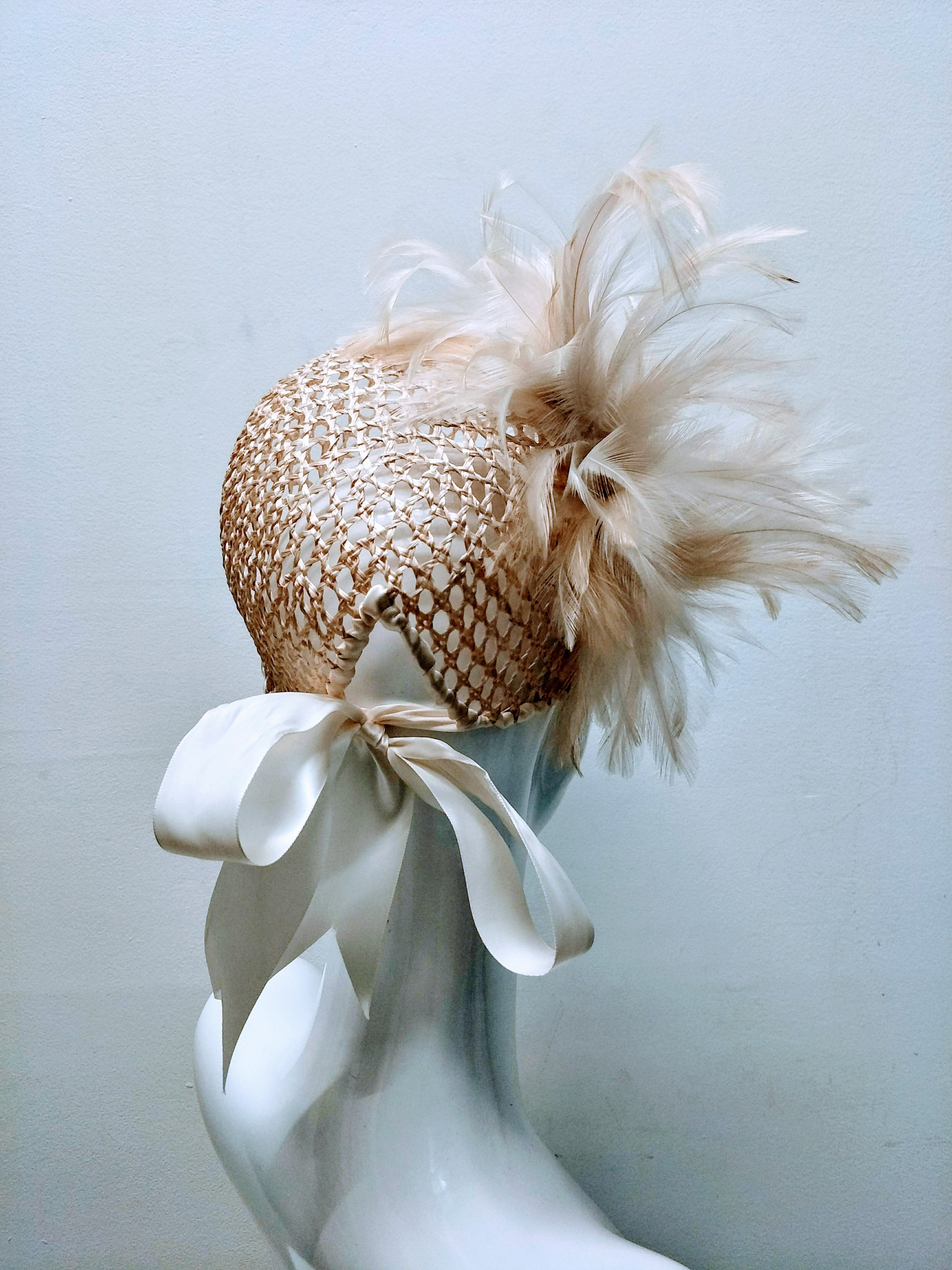 Foxy cap from the Kathryn Lee Millinery collection featuring straw and feather