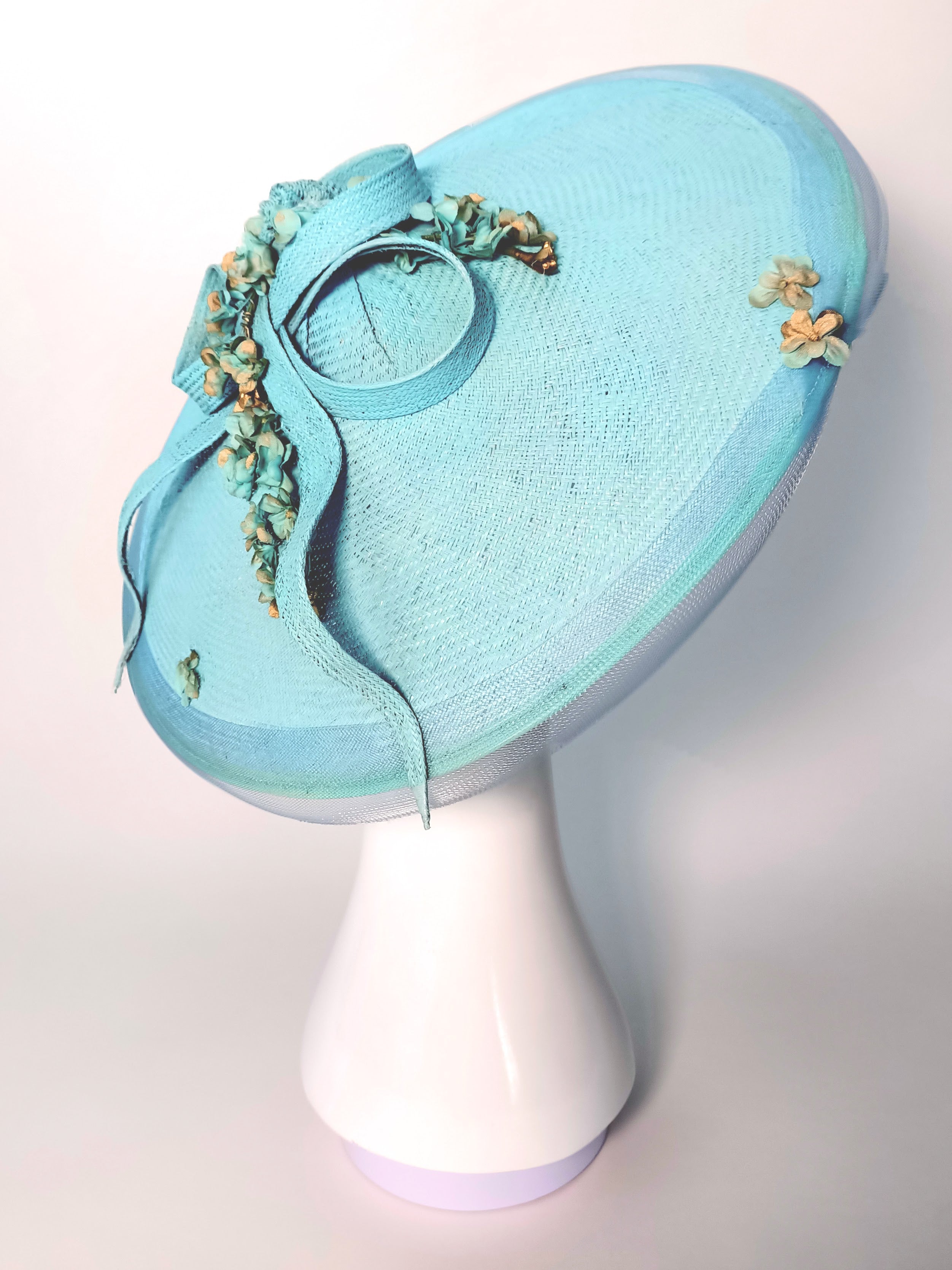 Gold Skye hat crafted from straw – luxury racing headwear by Kathryn Lee