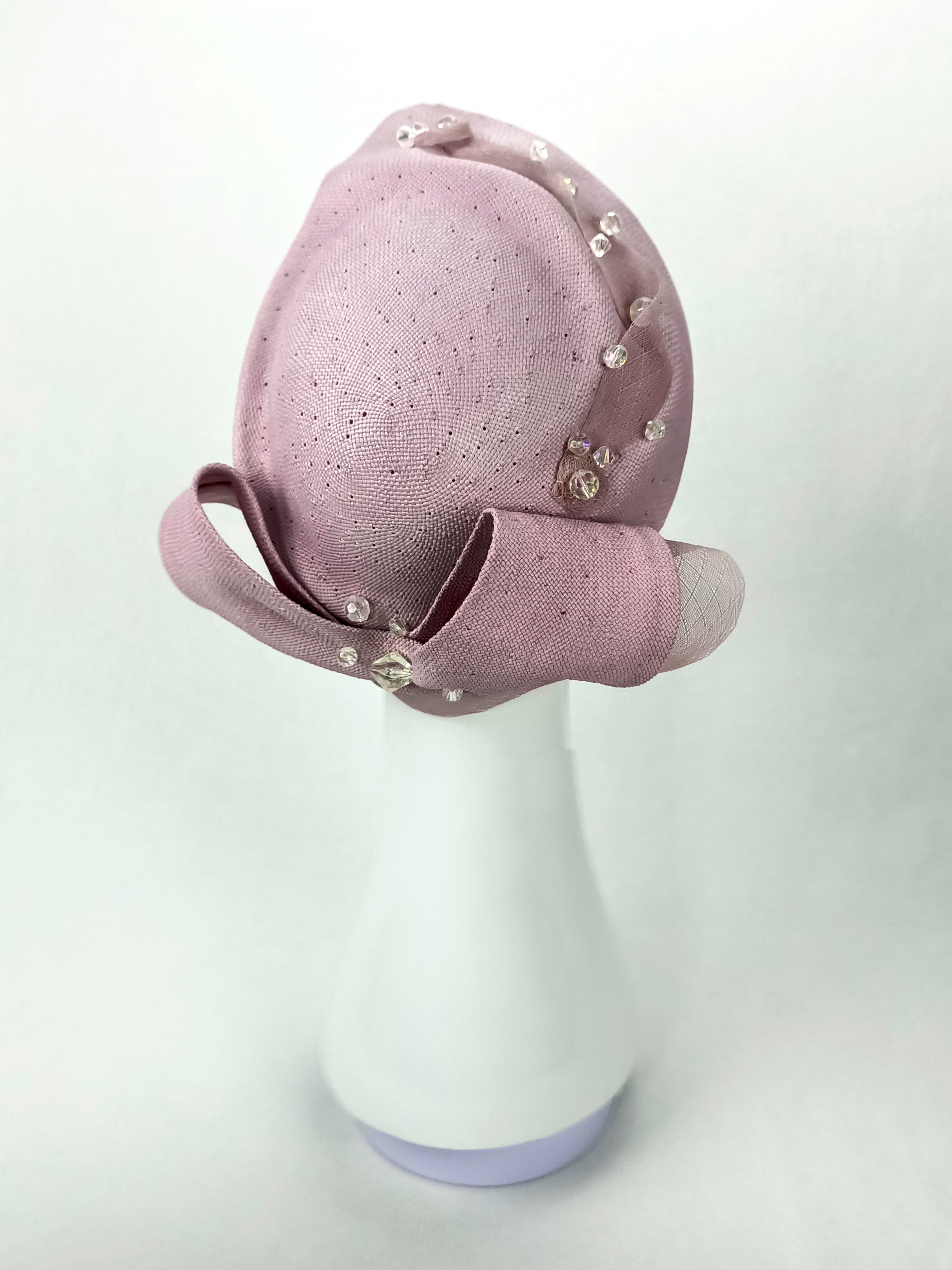 Violet pillbox hat from the Kathryn Lee Millinery collection featuring straw and pearl