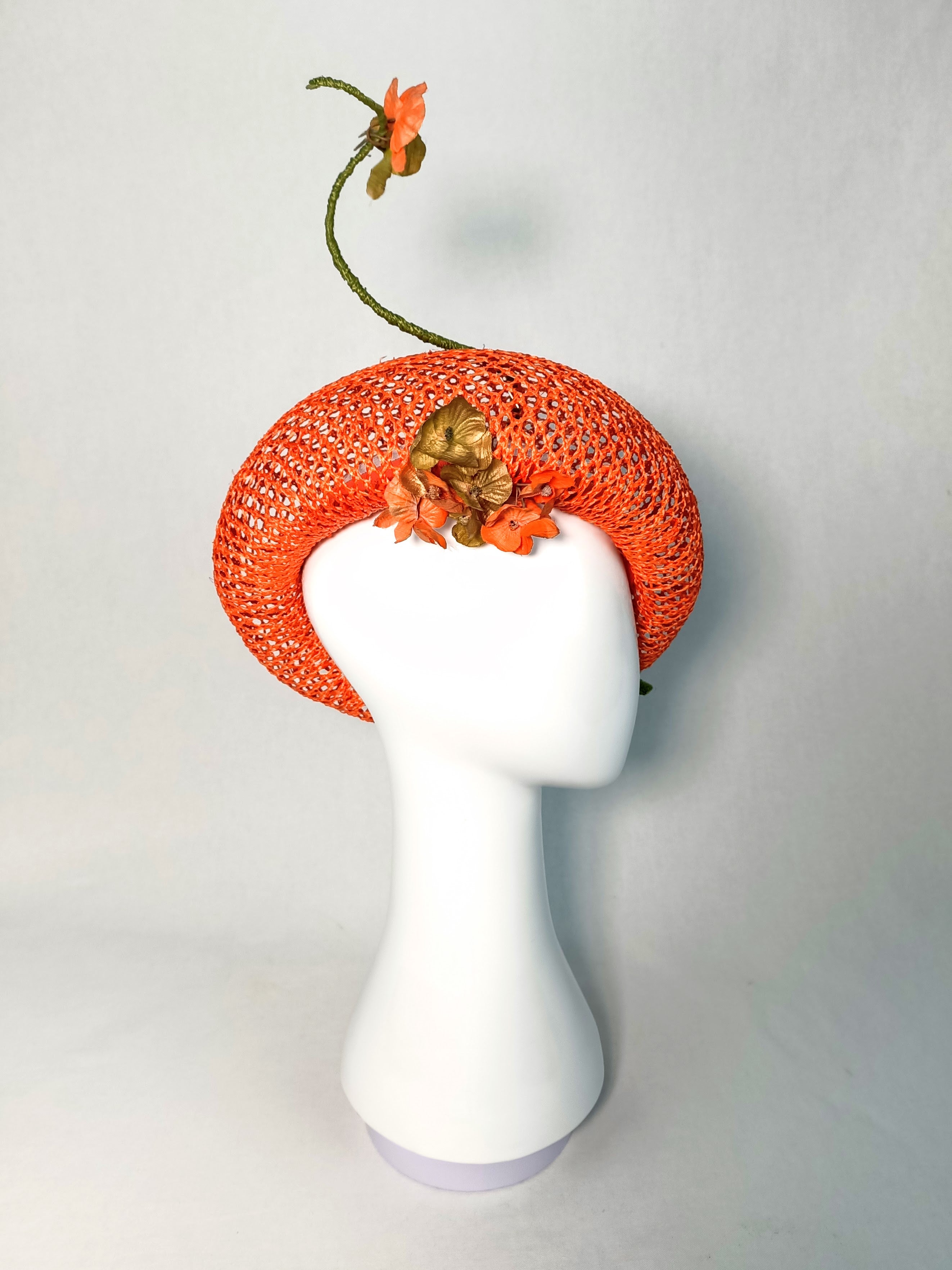 Orange Yvette beret crafted from straw and feather – luxury racing headwear by Kathryn Lee